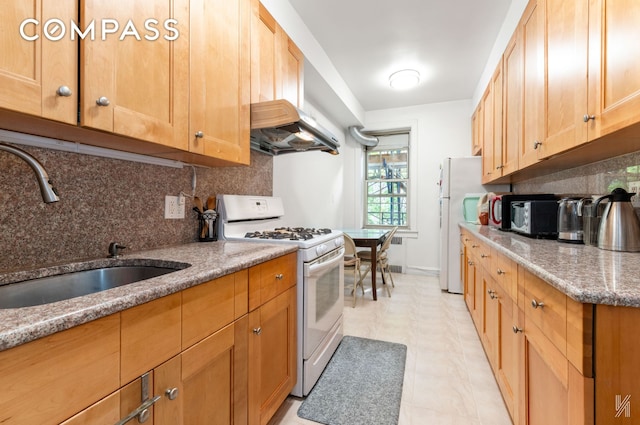 79-15 35th Ave Unit 3E, New York City, NY 11372 - kitchen featuring white appliances, ventilation hood, backsplash, and light stone counters