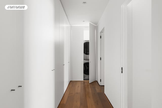 527 W 27th St Unit 3A, New York City, NY 10001 - hall featuring estacked washer and dryer and wood finished floors