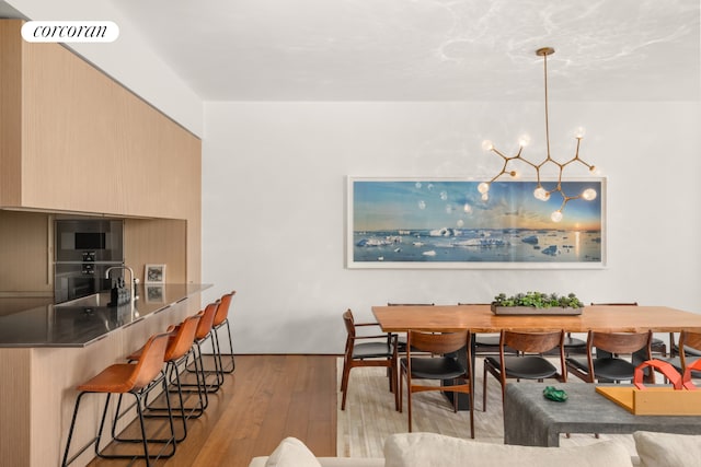 527 W 27th St Unit 3A, New York City, NY 10001 - dining area with light wood-style flooring