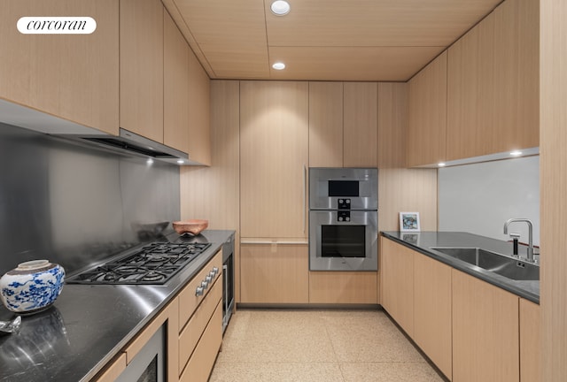 527 W 27th St Unit 3A, New York City, NY 10001 - kitchen with appliances with stainless steel finishes, light brown cabinets, light flooring, modern cabinets, and recessed lighting