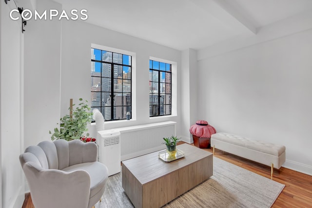 25 Tudor City Pl Unit 1405, New York City, NY 10017 - living area with light wood-style floors and baseboards