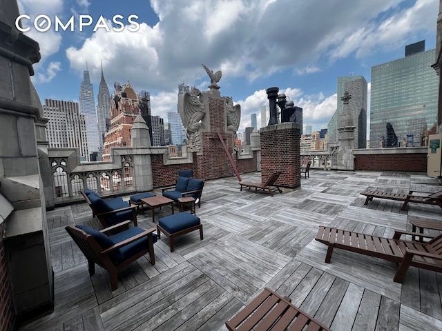25 Tudor City Pl Unit 1405, New York City, NY 10017 - wooden terrace featuring a skyline view
