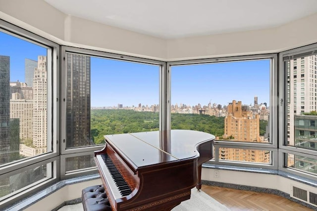 301 W 57th St Unit 27A, New York City, NY 10019 - sunroom featuring a view of city and healthy amount of natural light