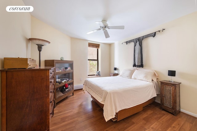 446 W 47th St Unit 3C, New York City, NY 10036 - bedroom with wood finished floors and ceiling fan