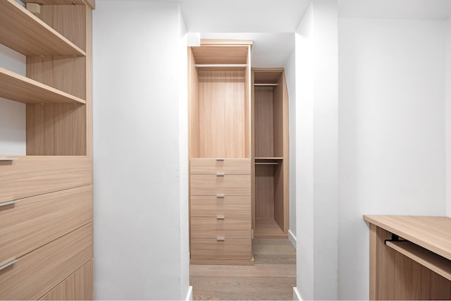 135 W 70th St Unit 10C, New York City, NY 10023 - walk in closet featuring light wood-style flooring