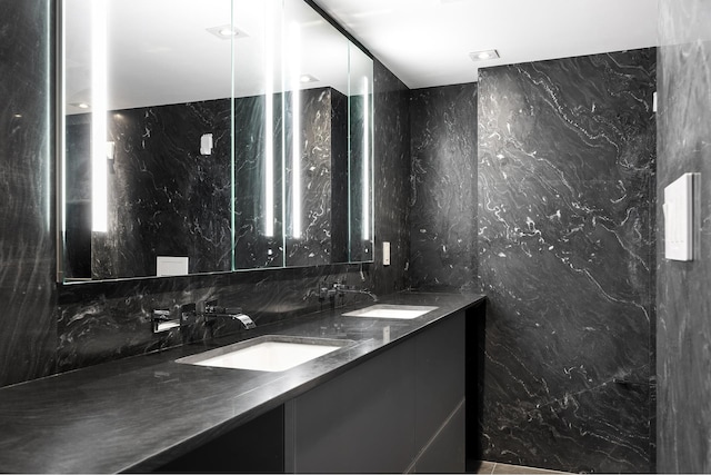 135 W 70th St Unit 10C, New York City, NY 10023 - bathroom with double vanity and decorative backsplash