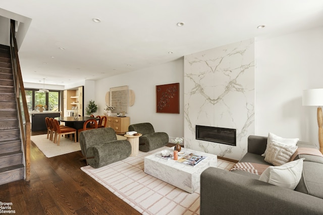10 Hancock St, New York City, NY 11216 - living room with wood finished floors, a premium fireplace, recessed lighting, and stairway