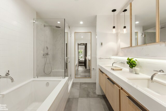 10 Hancock St, New York City, NY 11216 - full bath with a bath, a marble finish shower, double vanity, recessed lighting, and ensuite bath