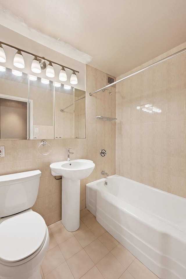 180 Park Row Unit 5B, New York City, NY 10038 - full bathroom featuring tile walls, tub / shower combination, and tile patterned flooring