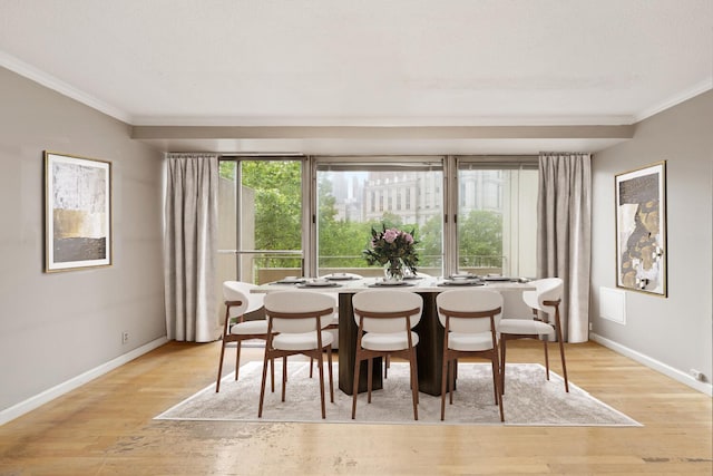 180 Park Row Unit 5B, New York City, NY 10038 - dining space featuring crown molding and light wood-type flooring