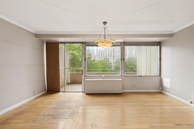 180 Park Row Unit 5B, New York City, NY 10038 - unfurnished dining area featuring crown molding and wood finished floors