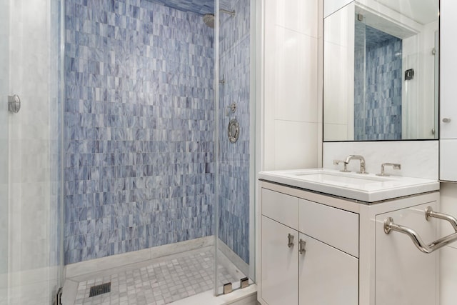 21 E 61st St Unit 9C, New York City, NY 10065 - bathroom featuring a stall shower and vanity