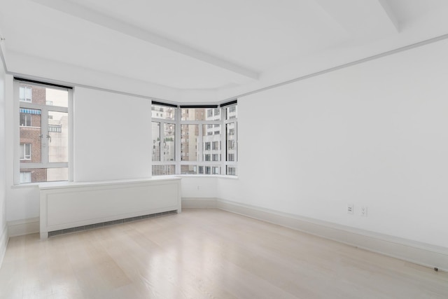 21 E 61st St Unit 9C, New York City, NY 10065 - empty room featuring radiator and wood finished floors