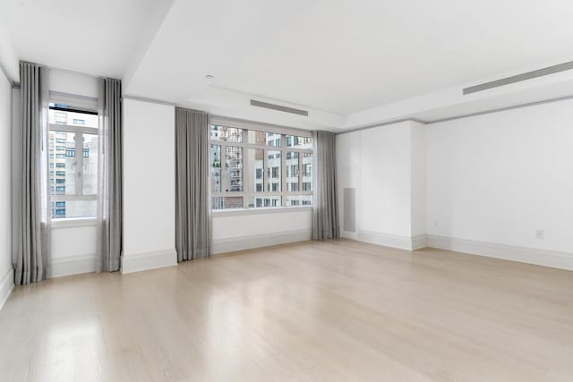 21 E 61st St Unit 9C, New York City, NY 10065 - unfurnished room with light wood-type flooring and baseboards