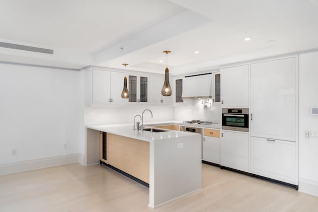 21 E 61st St Unit 9C, New York City, NY 10065 - kitchen featuring custom range hood, light wood-style floors, glass insert cabinets, stainless steel appliances, and recessed lighting