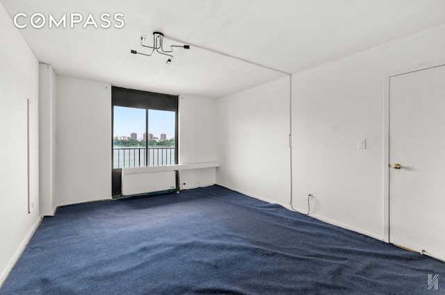 25-40 Shore Blvd Unit 4R, New York City, NY 11102 - empty room featuring carpet floors and a water view