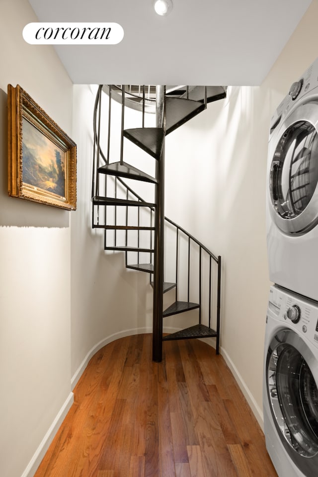 8 8th Ave Unit 2B, New York City, NY 11217 - washroom featuring stacked washer / dryer and wood finished floors