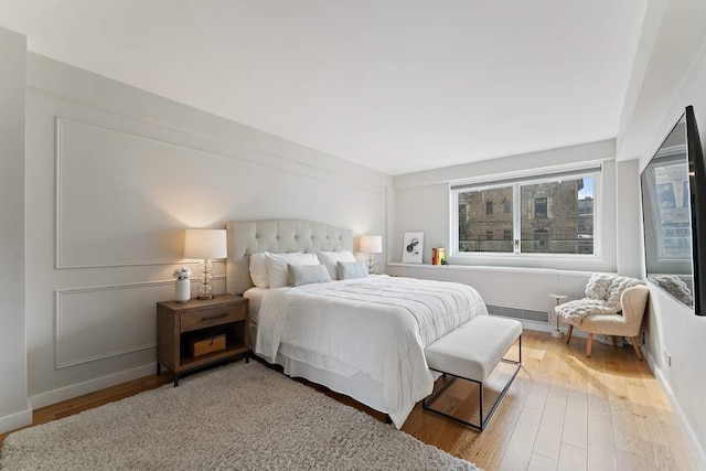 20 E 68th St Unit 12D, New York City, NY 10065 - bedroom with wood finished floors