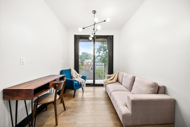 785 E 34th St Unit 2C, New York City, NY 11210 - living room featuring lofted ceiling, a chandelier, and light wood-type flooring