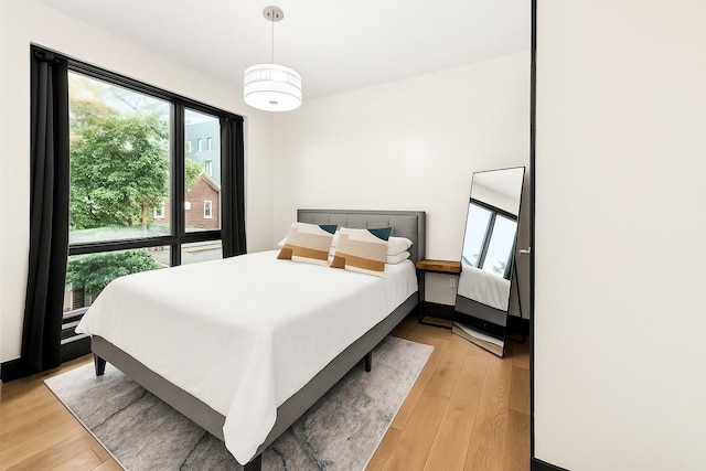 785 E 34th St Unit 2C, New York City, NY 11210 - bedroom with light wood-type flooring