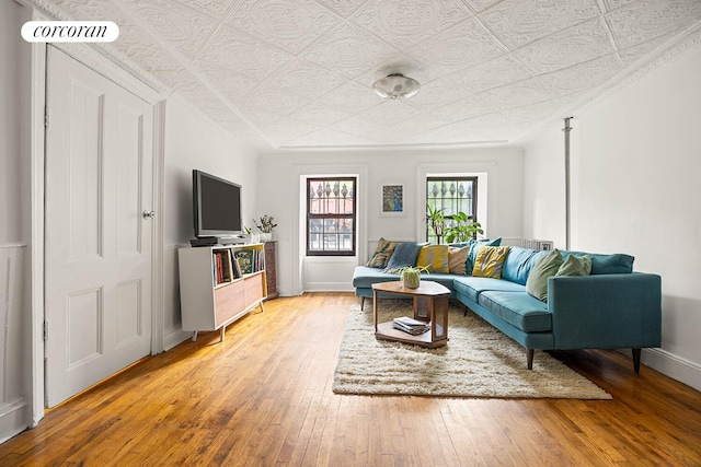66 Putnam Ave, New York City, NY 11238 - living area featuring an ornate ceiling and light wood finished floors