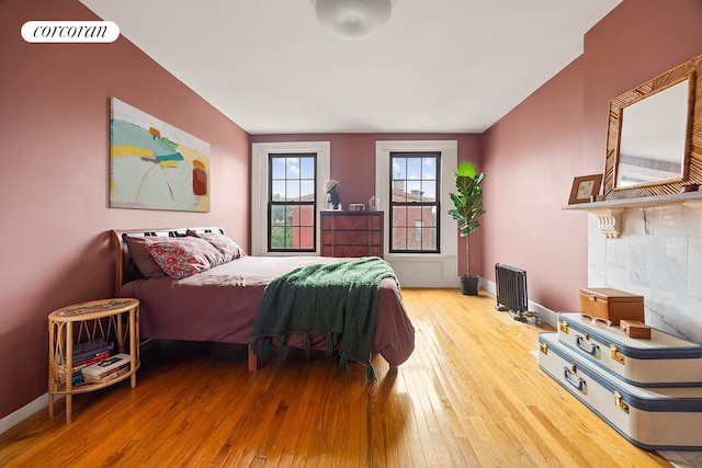 66 Putnam Ave, New York City, NY 11238 - bedroom featuring radiator and hardwood / wood-style flooring