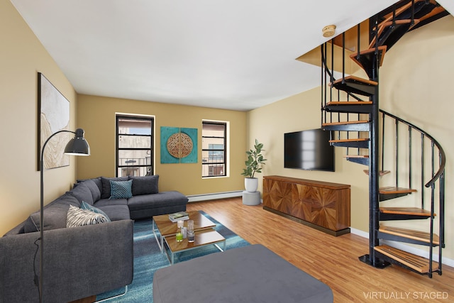 299 13th St Unit 4B, New York City, NY 11215 - living area featuring stairway, a baseboard heating unit, and wood finished floors