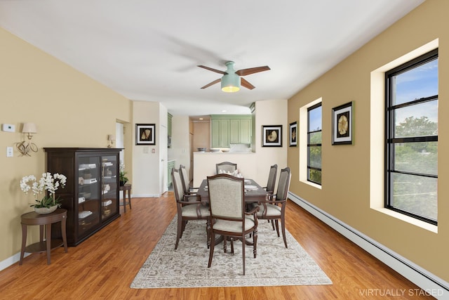 299 13th St Unit 4B, New York City, NY 11215 - dining space with a baseboard heating unit, light wood finished floors, and ceiling fan