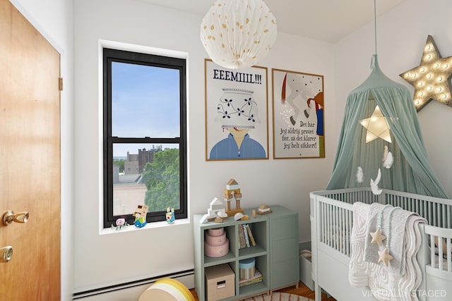 299 13th St Unit 4B, New York City, NY 11215 - bedroom with baseboard heating and a nursery area