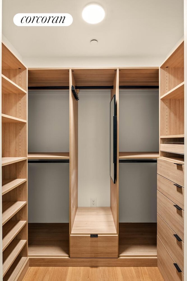 450 Warren St Unit 2C, New York City, NY 11217 - walk in closet featuring wood finished floors