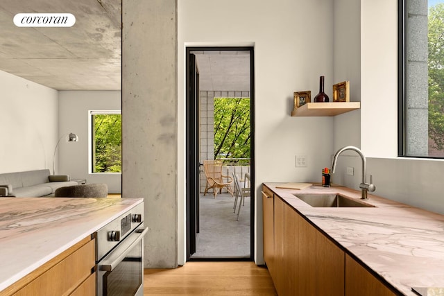 450 Warren St Unit 2C, New York City, NY 11217 - kitchen with light wood-style flooring, stainless steel oven, and open shelves