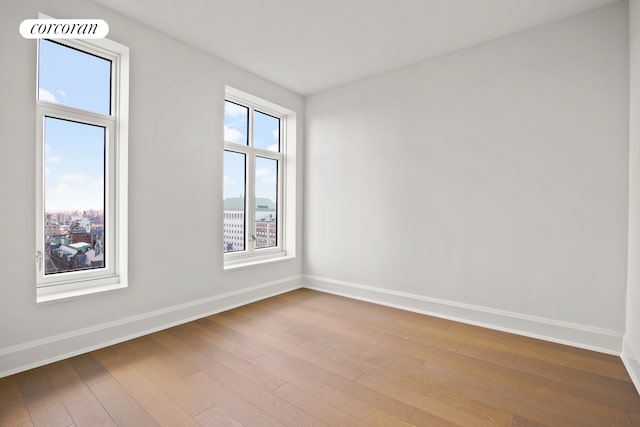 100 Claremont Ave Unit 12D, New York City, NY 10027 - unfurnished room with baseboards and hardwood / wood-style floors