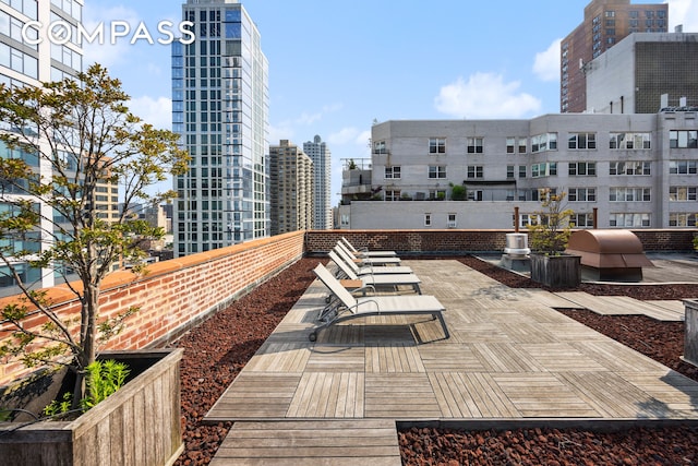 166 E 35th St Unit 5F, New York City, NY 10016 - view of patio / terrace with grilling area and a view of city