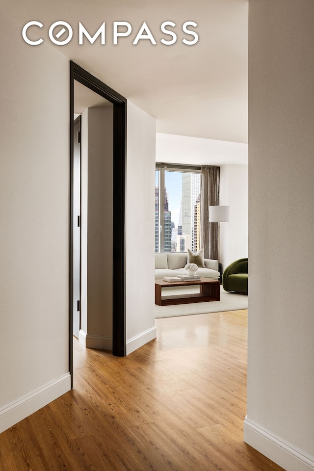 247 W 46th St Unit 3103, New York City, NY 10036 - corridor featuring wood finished floors