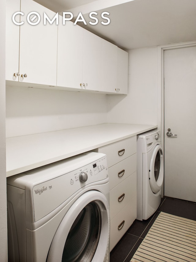 161 Jackson St Unit 1, New York City, NY 11211 - washroom with cabinet space, washer and dryer, and dark tile patterned flooring