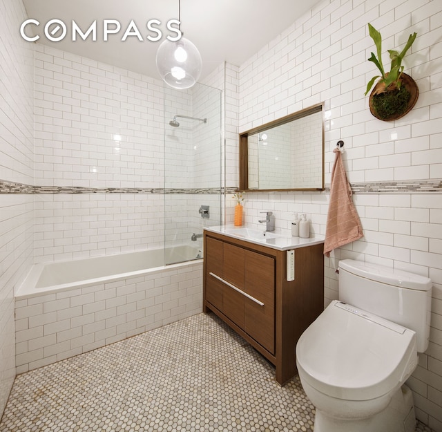 161 Jackson St Unit 1, New York City, NY 11211 - bathroom with tile walls, vanity, tile patterned floors, and tiled shower / bath combo
