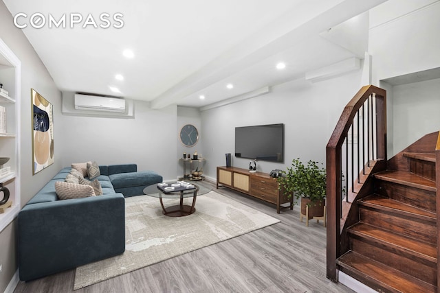 170 Skillman Ave, New York City, NY 11211 - living room with a wall mounted air conditioner, wood finished floors, recessed lighting, and stairs