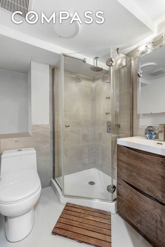 170 Skillman Ave, New York City, NY 11211 - full bathroom with tile walls, vanity, a stall shower, and tile patterned floors