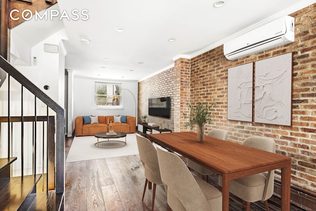 170 Skillman Ave, New York City, NY 11211 - dining space featuring a wall mounted AC, wood finished floors, brick wall, ornamental molding, and stairs