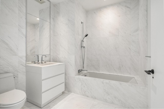111 Murray St Unit 30A, New York City, NY 10007 - bathroom featuring a combined bath / shower with marble appearance, vanity, tile walls, and marble finish flooring