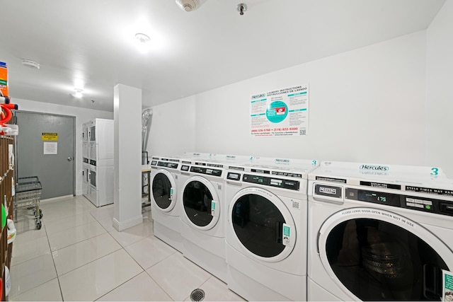 378 Baltic St Unit 9C, New York City, NY 11201 - shared laundry with independent washer and dryer, stacked washer / drying machine, and light tile patterned floors