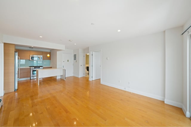 378 Baltic St Unit 9C, New York City, NY 11201 - unfurnished living room with light wood-style flooring and recessed lighting