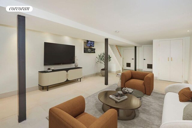 824A Quincy St, New York City, NY 11221 - living room featuring stairs and baseboards