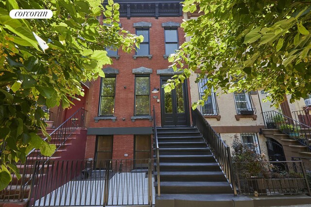 824A Quincy St, New York City, NY 11221 - view of front of house featuring stairway and brick siding