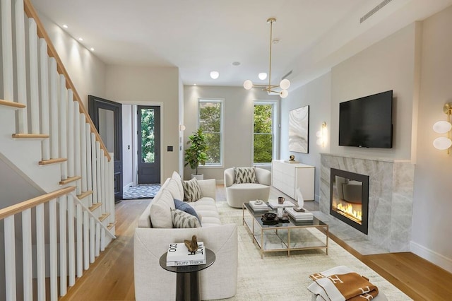 824A Quincy St, New York City, NY 11221 - living room featuring wood finished floors, stairway, a premium fireplace, and recessed lighting
