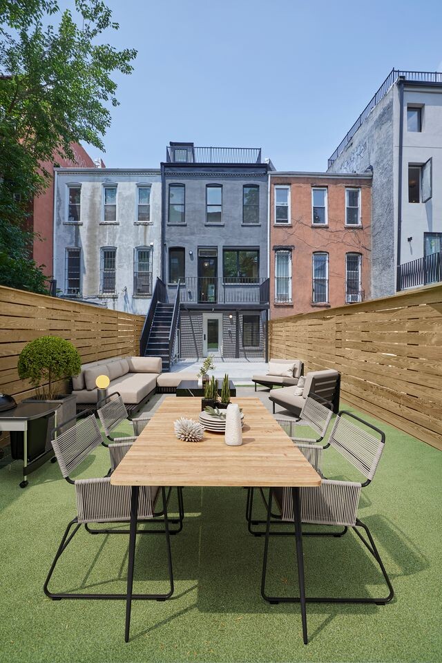 824A Quincy St, New York City, NY 11221 - rear view of property with an outdoor living space