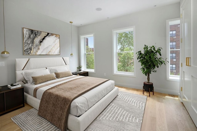 824A Quincy St, New York City, NY 11221 - bedroom featuring light wood finished floors and baseboards