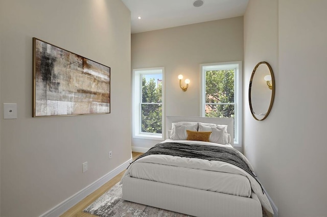 824A Quincy St, New York City, NY 11221 - bedroom featuring multiple windows and wood finished floors