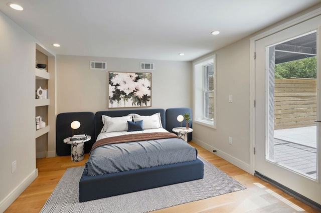 824A Quincy St, New York City, NY 11221 - bedroom featuring light wood-style floors, access to outside, and recessed lighting