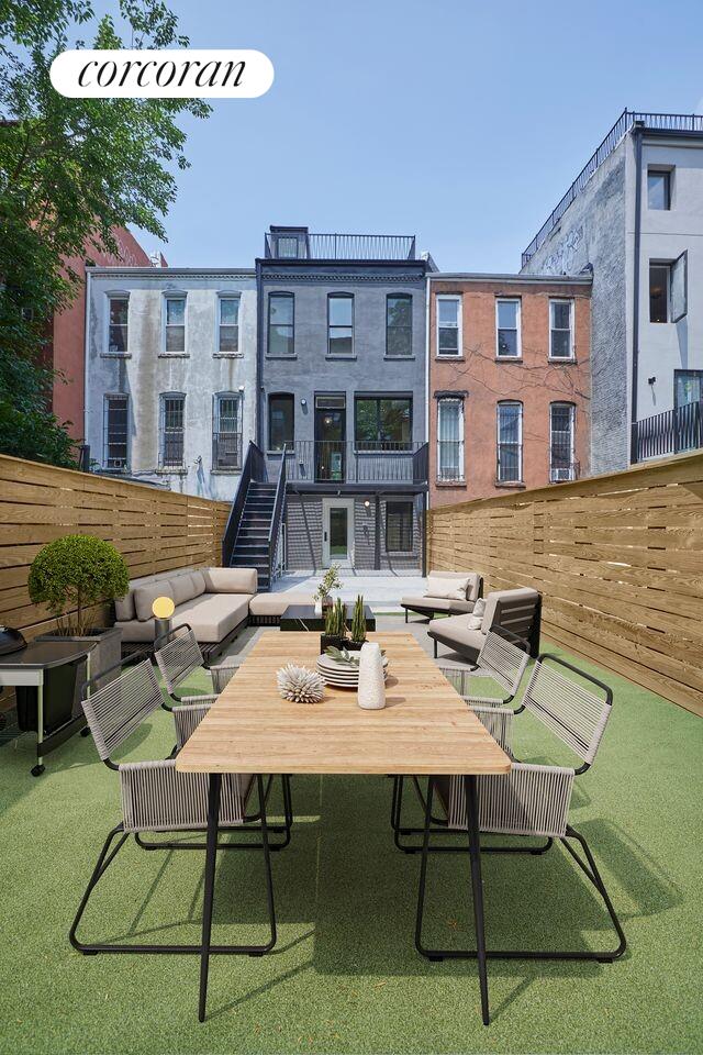 824A Quincy St, New York City, NY 11221 - back of house featuring an outdoor living space